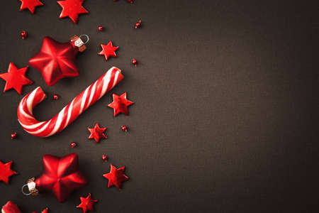 Christmas candy and decorations on dark background