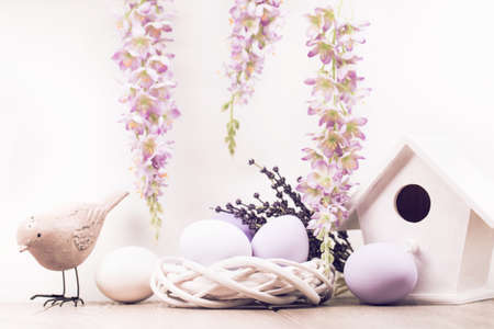 Easter decoration with eggs and flowers on white background