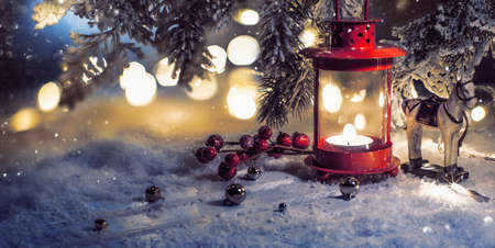 Christmas evening composition with decorations and candlestick. Holiday background