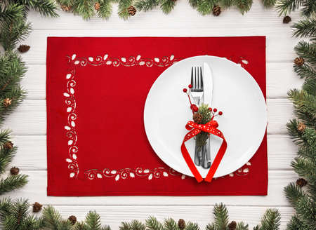 Christmas and New Year celebration, served table with fir branches and cones. Holiday food backgroundの写真素材