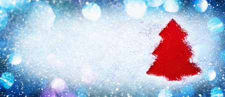 Christmas tree silhouette on sparkling snow. Holiday background Happy New Yearの写真素材