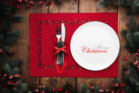 Christmas and New Year celebration, served table with fir branches and cones. Holiday food...