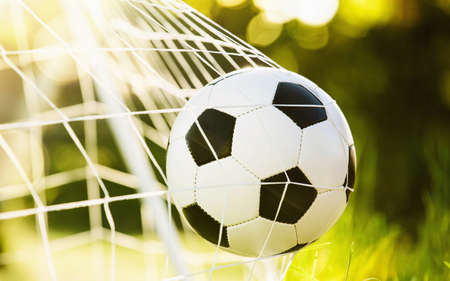 Soccer ball in goalの写真素材