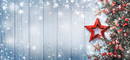 Christmas Decoration with Star and Snowflakes on Wooden Background