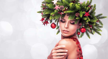 Beauty Fashion Model Girl with Fir Branches Decorationの写真素材