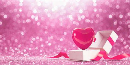 Gift with Heart on Pink Shiny Backgroundの写真素材