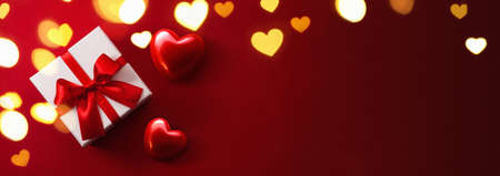 Gift with Hearts on Red Backgroundの写真素材
