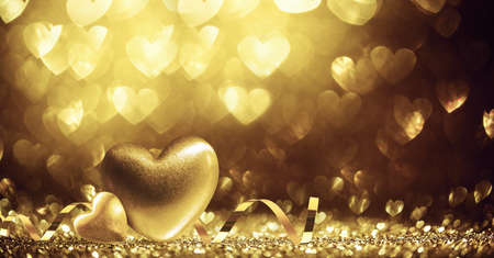 Two Hearts On Shiny Gold Backgroundの写真素材