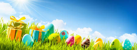 Spring Natural Background With Easter Eggs and Fresh Green Grassの写真素材