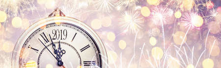 Happy New Year 2019 celebration with dial clock and fireworks. Abstract holiday backgroundの写真素材