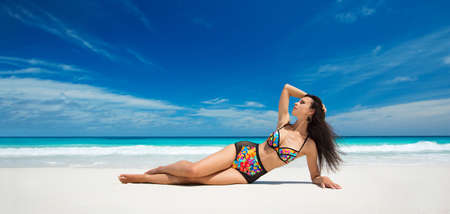 Happy Woman on the Beach of Ocean. Enjoying Every Moment. Summer Vacationの写真素材