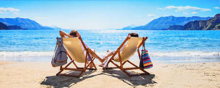 Happy Couple Relaxing on the Beach. Summer Vacationの写真素材
