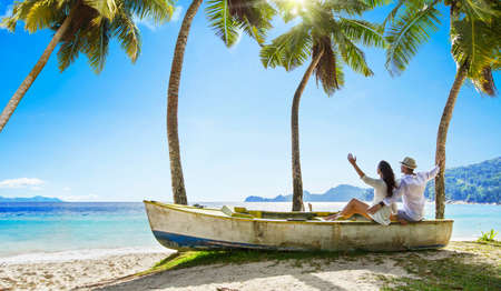 Happy Couple Relaxing on the Ocean. Seychelles Island Summer Vacationの写真素材