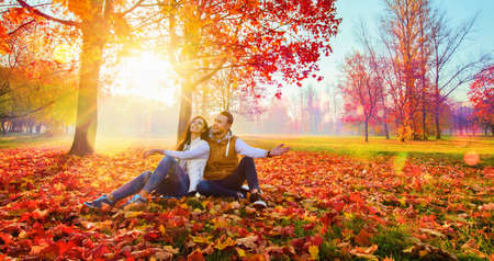 Happy Couple Enjoying The Fall Season. Autumn Landscape. Fall Sceneの写真素材