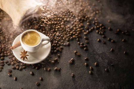 Coffee Cup With Beans On a Dark Backgroundの写真素材