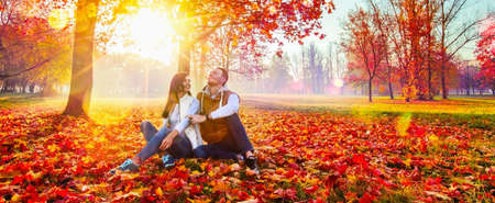 Happy Couple Enjoying The Fall Season. Autumn Landscape. Fall Sceneの写真素材