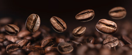 Brown Roasted Coffee Beans Closeup On Dark Backgroundの写真素材