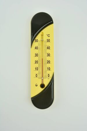 Isolated light-color thermometer on white background. Thermometer shows temperature. Mercury...