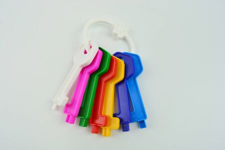 Plastic color keys on white background. Collection of plastic keys. Color keysの写真素材