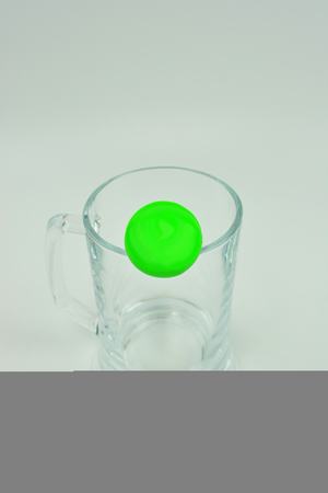 Transparent glass with green circle. Place your text. Big transparent glass for bearの写真素材