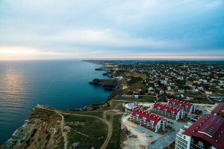 Beach on Black Sea. Fiolent beach. Beautiful landscape. Panorama view of Crimean beach. Many private houses on a beachの写真素材