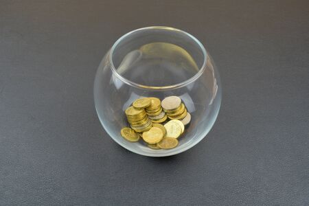 Glass vase with russian coins. Transparent vase on black backgroundの写真素材