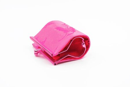 Pink closed purse on the white background. Woman accessory.