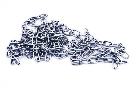 Silver chain on white background. Long circuit on white background. Metal silver chain. Chain with small cellsの写真素材