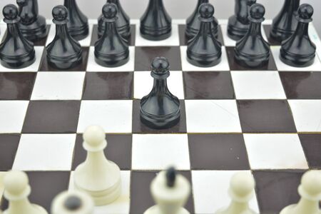 Chess composition. Initial state on chess table. Black and white chess figures. Play board for chess.の写真素材