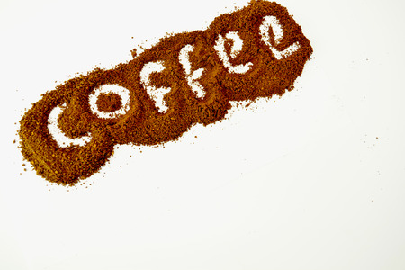 "Coffee" word written on ground coffee layer.の写真素材