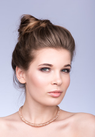 Beuty portrait. Horizontal position. Look at the camera. A light smileの写真素材