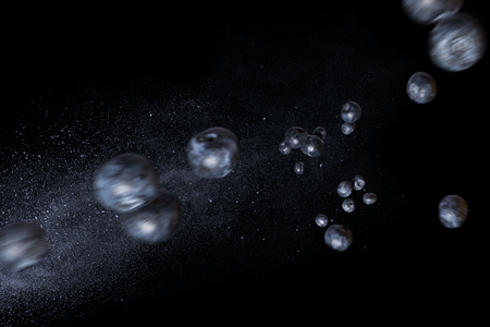 Flying handful of blueberries on a black background. Dynamic photo of berries. Horizontal orientationの写真素材