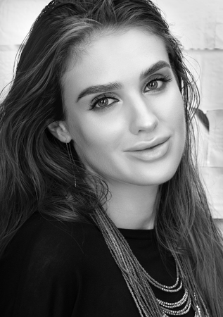 Black and white beauty portrait of beautiful young woman with a necklace around her neck. Professional makeupの写真素材