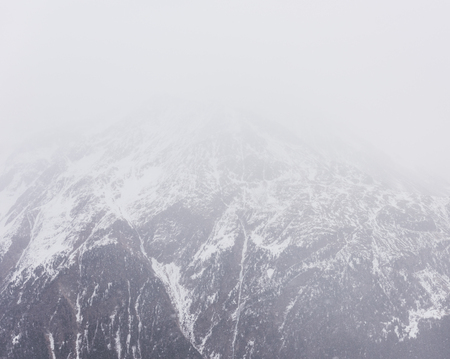 The mountain in the snow. Winter foggy landscapeの写真素材