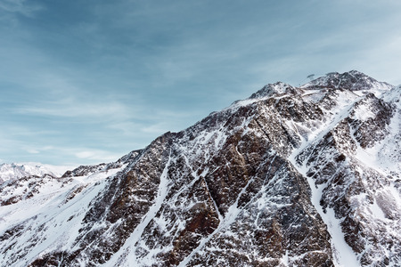 Snowy mountain peak against the sky. Alpine ski resort in Austriaの写真素材