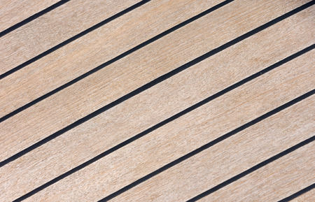 The flooring of the yacht close-up. Wooden boards with black seams.の写真素材