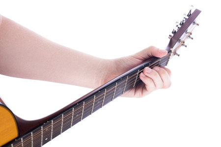 The position of the left male hand on the guitar neck, chord C. Learning to play the guitar. Isolate on white backgroundの写真素材