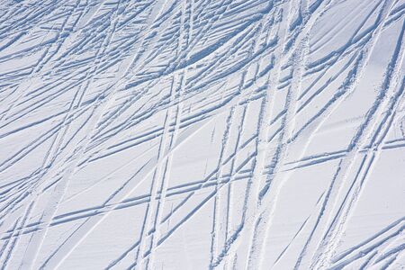 Ski tracks on fresh snow. Natural background with linesの写真素材