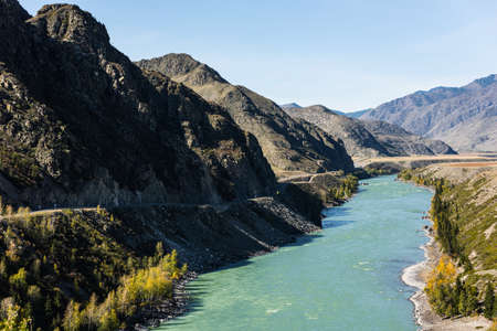 Mountain road with a beautiful view of the mountains and the river.