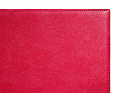 Red fine texture of genuine leather. Close-up edge isolated at white background.の写真素材
