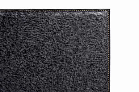 Black fine texture of genuine leather. Close-up edge. White threds.の写真素材