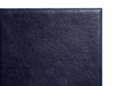 Black fine texture of genuine leather. Close-up edge. Blue threds.の写真素材