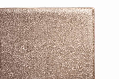 Biege rough texture of genuine leather. Close-up edge isolated at white background.の写真素材