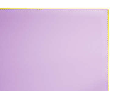 Lilac fine texture of genuine leather. Close-up edge isolated at white background.の写真素材