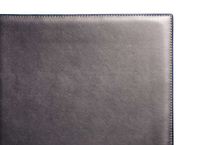 Gray fine texture of genuine leather. Close-up edge isolated at white background.の写真素材