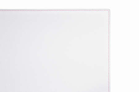 White fine texture of genuine leather. Close-up edge with red threds.の写真素材