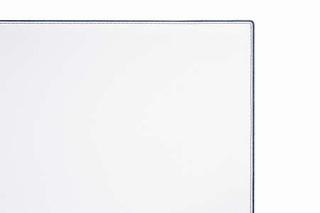 White fine leather with soft texture. Close-up edge with black threds.の写真素材