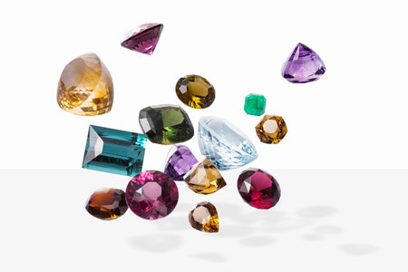 Flying perfect faceted gems with shadows. Shining luxury jewels.の写真素材