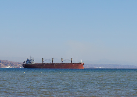 Cargo ship entering the harbor at the Red Sea