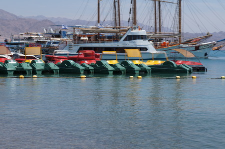 Green pedal boats on the sea
